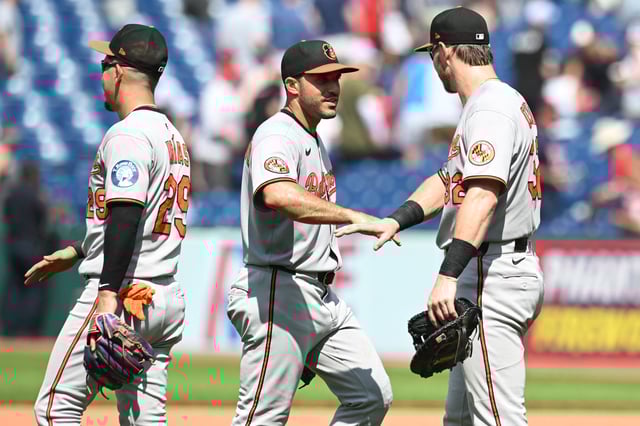 Jul 24, 2025; Cleveland, Ohio, USA; Baltimore Orioles left fielder Ramon Laureano (12) and third baseman Ramon Urias (29) and first baseman Ryan O'Hearn (32) celebrate after the Orioles beat the Cleveland Guardians at Progressive Field. Mandatory Credit: Ken Blaze-Imagn Images
