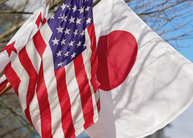 Japanese and U.S. Flags fly side by side outside the White House in Washington, U.S., April 5, 2024.  REUTERS/Kevin Lamarque/ File Photo