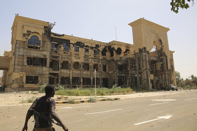 FILE - An army soldier walks in front of the Republican Palace in Khartoum, Sudan, after it was taken over by Sudan's army, March 21, 2025. (AP Photo, file)