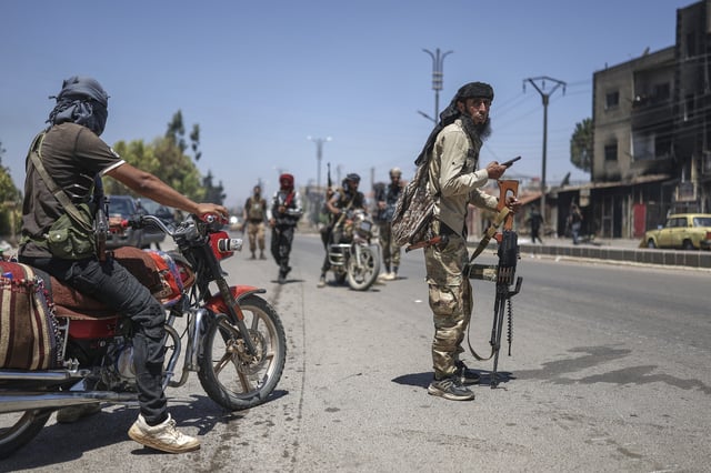 FILE - Bedouin fighters deploy at Mazraa village on the outskirts of Sweida city, during clashes between the Bedouin clans and Druze militias, southern Syria, Friday, July 18, 2025. (AP Photo/Ghaith Alsayed, File)