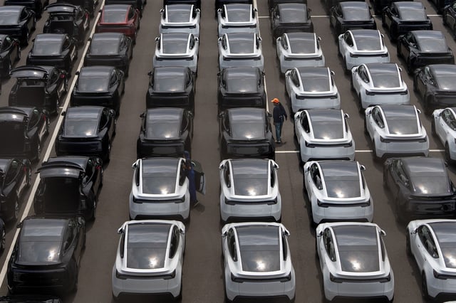 Imported Tesla electric vehicles awaiting shipment are parked at a port on July 07, 2025 in Yokohama, Japan.