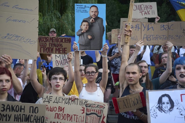 Demonstrators protest against a new bill proposed by President Volodymyr Zelenskyy restoring the independence of the country’s anti-corruption agencies, in Kyiv, Ukraine, Thursday, July 24, 2025. (AP Photo/Efrem Lukatsky)