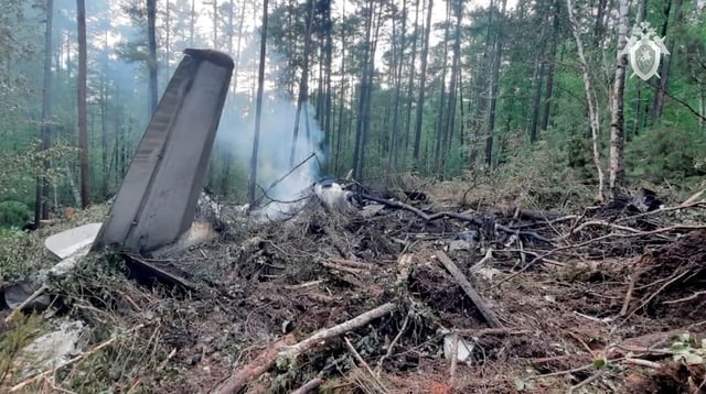 A view shows the debris of an Angara Airlines An-24 passenger aircraft at the crash site near Tynda in the Amur Region, Russia July 24, 2025, in this still image taken from video. Russian Investigative Committee/Handout via REUTERS/File Photo