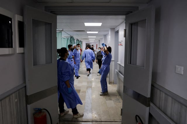 Medical personnel work at a hospital, following deadly clashes between Druze fighters, Sunni Bedouin tribes and government forces, in Syria's predominantly Druze city of Sweida, Syria July 25, 2025. REUTERS/Khalil Ashawi