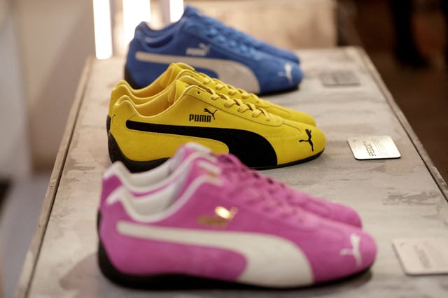 Puma Speedcat OG sneakers are displayed at the Puma Mostro House in Paris, France, January 24, 2025. REUTERS/Abdul Saboor/File Photo