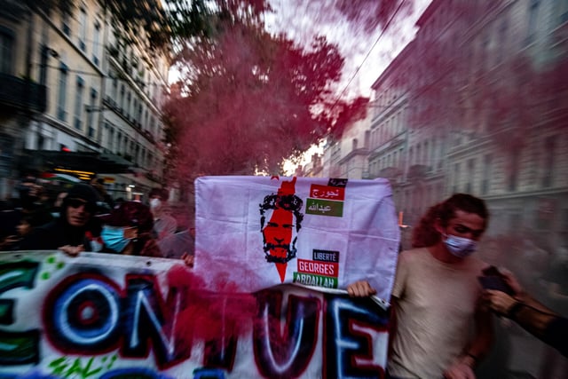 Pro-Palestine protesters in Lyon, France, hold up banners reading “Silence: We are killing in Gaza” and “Freedom for Georges Abdallah” on Oct. 9, 2023. (Robert Deyrail/Gamma-Rapho via Getty Images)