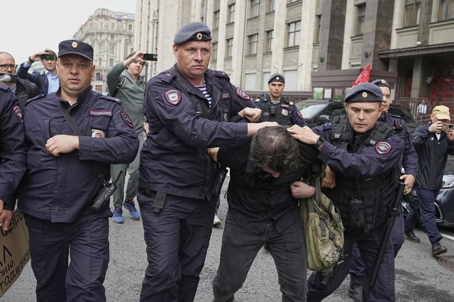 Police detain an activist during a protest in front of the State Duma, the lower house of the Russian parliament, in Moscow, Russia, Tuesday, July 22, 2025, prior to lawmakers approving a measure that punishes online searches for information that is deemed “extremist.” 