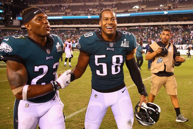 Rodney McLeod #23 and Jordan Hicks #58 of the Philadelphia Eagles react after defeating the Atlanta Falcons 18-12 at Lincoln Financial Field on September 6, 2018 in Philadelphia, Pennsylvania.
