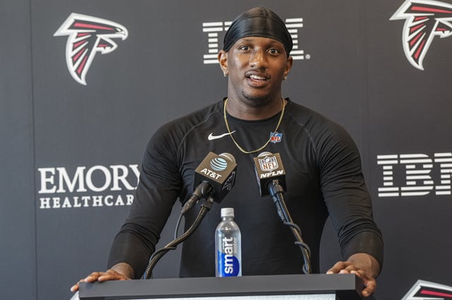Jul 24, 2025; Flowery Branch, GA, USA; Atlanta Falcons quarterback Michael Penix Jr. (9) talks to the media after practice during training camp at IBM Performance Field. Mandatory Credit: Dale Zanine-Imagn Images/File Photo