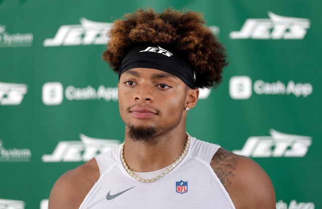 New York Jets quarterback Justin Fields (7) speaks to the media after an NFL football training camp, Wednesday, July 23, 2025, in Florham Park, N.J. (AP Photo/Adam Hunger)