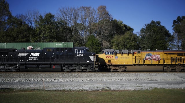 A Norfolk Southern (L) locomotive and Union Pacific locomotive are seen in Burnside, Kentucky