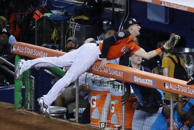 MIAMI, FL - JULY 09: Ryan McMahon #9 of the Colorado Rockies and the U.S. Team catches a ball hit by Vladimir Guerrero Jr. #27 of the Toronto Blue Jays and the World Team for an out in the ninth inning during the SiriusXM All-Star Futures Game at Marlins Park on July 9, 2017 in Miami, Florida.