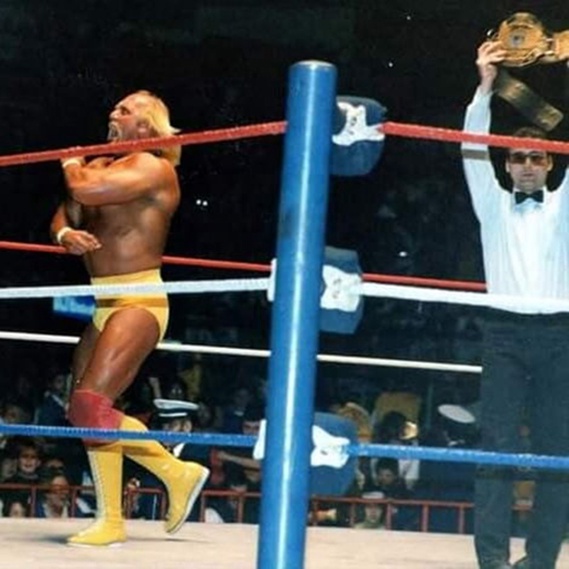 Hulk Hogan celebrates a win at Toronto's Maple Leaf Gardens in a 1988 handout photo, as referee Jimmy Korderas raises the World Heavyweight Championship belt. 