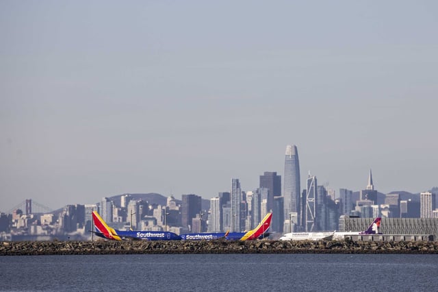 Aircraft taxi on the runway at Oakland International Airport. The Port of Oakland officially renamed its airport as Oakland San Francisco Bay Airport on Thursday, reigniting a legal dispute with San Francisco.