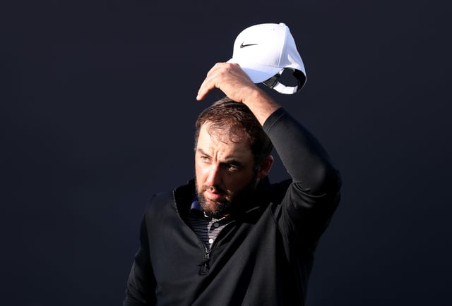Scottie Scheffler of the United States reacts after finishing his round on the 18th green during Day Three of The 153rd Open Championship at Royal Portrush Golf Club on July 19, 2025 in Portrush, Northern Ireland.