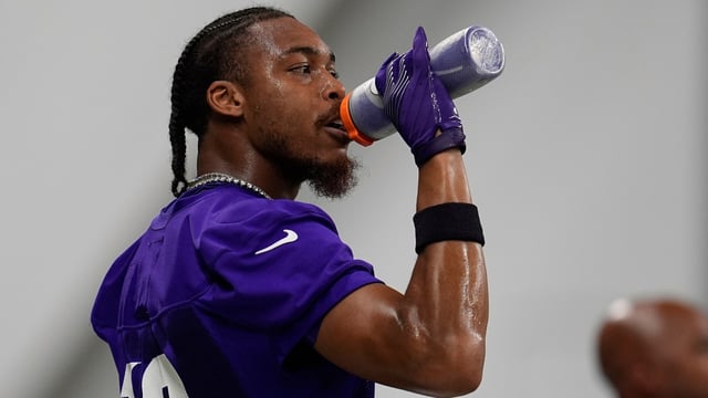 Minnesota Vikings wide receiver Justin Jefferson (18) hydrates during the team's NFL football training camp Wednesday, July 23.