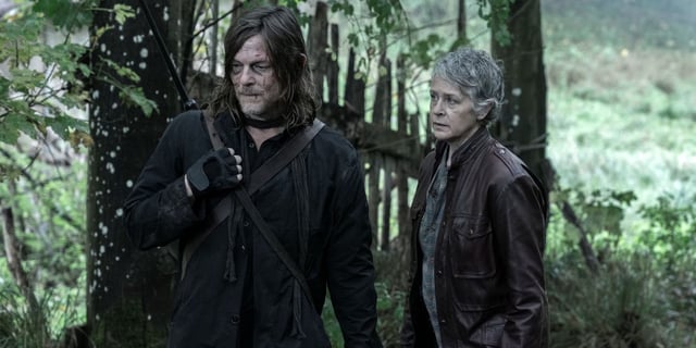 Norman Reedus as Daryl standing outside next to Melissa McBride in The Walking Dead: Daryl Dixon Season 2.