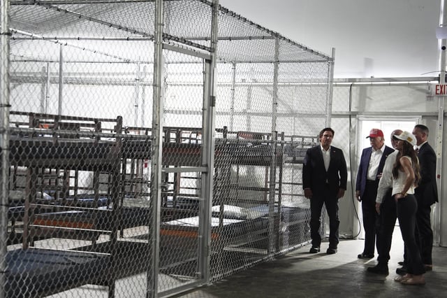 President Donald Trump, Gov. Ron DeSantis, R-Fla., and Homeland Security Secretary Kristi Noem, and others, tour &#34;Alligator Alcatraz,&#34; a new migrant detention facility at Dade-Collier Training and Transition facility, Tuesday, July 1, 2025, in Ochopee, Fla.