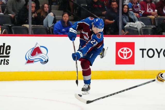 Sep 25, 2022; Denver, Colorado, USA; Colorado Avalanche left wing Oskar Olausson (27) shoots the puck in the second period against the Vegas Golden Knights at Ball Arena. Mandatory Credit: Ron Chenoy-USA TODAY Sports/ File Photo