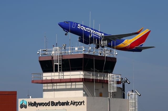 BURBANK, CALIFORNIA – SEPTEMBER 25: A Southwest Airlines take off past the control tower at Burbank Hollywood Airport on September 25, 2023 in Burbank, California. Transportation Secretary Pete Buttigieg is warning that vital training for new air traffic controllers would be paused if the government shuts down later this week. The Department of Transportation currently has 2,600 much needed air traffic controllers undergoing training and employs 1,200 fewer certified controllers than that agency did 10 years ago. (Photo by Justin Sullivan/Getty Images)
