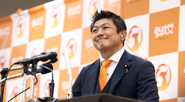 Japan's opposition party Sanseito leader Sohei Kamiya smiles as he speaks to members of the media at the vote counting center in Tokyo on July 20, 2025. (Jiji Press/AFP via Getty Images)