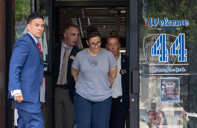 Stephanie Castillo is pictured in police custody leaving the NYPD&#39;s 44th Precinct stationhouse on Friday, June 19, 2025, in the Bronx. (Barry Williams / New York Daily News)