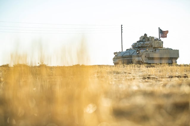 This September 2024 photo shows US forces patrolling oil fields in Syria.