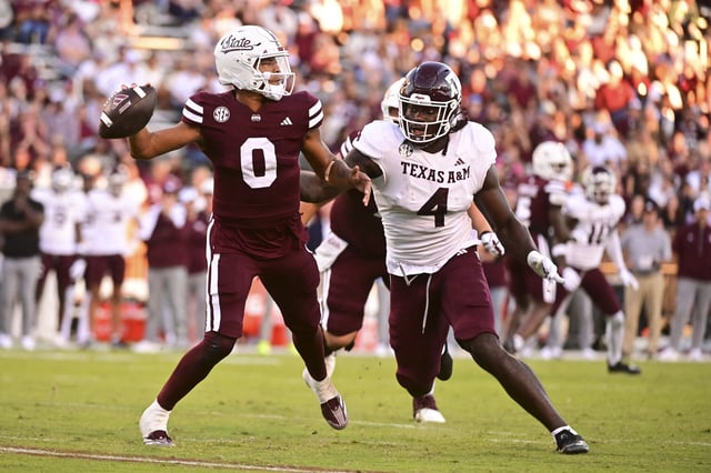 Oct 19, 2024; Starkville, Mississippi, USA;Mississippi State Bulldogs quarterback Michael Van Buren Jr. (0) drops back to pass against Texas A&M Aggies defensive lineman Shemar Stewart (4) during the third quarter at Davis Wade Stadium at Scott Field. Mandatory Credit: Matt Bush-Imagn Images/ File Photo