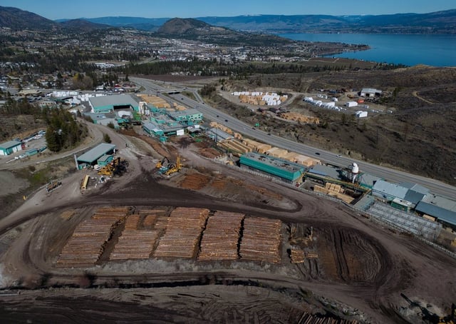 In an aerial view, logs are seen stacked at Gorman Brothers Lumber sawmill, in West Kelowna, B.C., on Friday, April 4, 2025. THE CANADIAN PRESS/Darryl Dyck