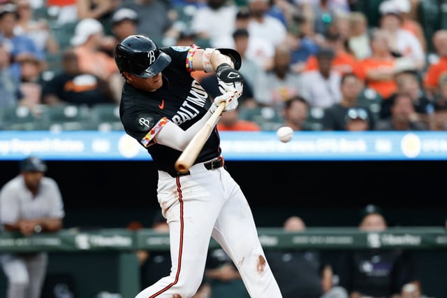 Baltimore Orioles’ Coby Mayo hits a home run off Colorado Rockies pitcher Kyle Freeland during the second inning of a baseball game in Baltimore, Friday, July 25, 2025. (AP Photo/Terrance Williams)