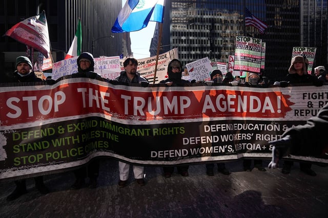 Anti-Trump protesters march to Trump Tower as they rally for a number of issues, including immigrant rights, the Israel-Hamas war, women's reproductive rights, racial equality and others, on the day of President Trump's Inauguration, Monday, Jan. 20, 2025, in Chicago.
