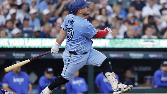 Jul 24, 2025; Detroit, Michigan, USA;  Toronto Blue Jays catcher Alejandro Kirk (30) hits a RBI single in the fifth inning against the Detroit Tigers at Comerica Park. Mandatory Credit: Rick Osentoski-Imagn Images