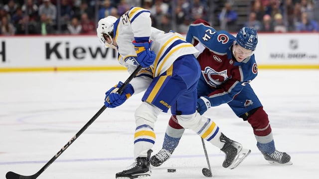 The Colorado Avalanche’s Oskar Olausson (24) competes for control of the puck against the Buffalo Sabres’ Jack Quinn (22) in the second period at Ball Arena on Jan. 2, 2025, in Denver. (Matthew Stockman/Getty Images/TNS)