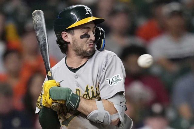 Athletics&#39; Jacob Wilson avoids being hit by a pitch thrown by Houston Astros pitcher Nick Hernandez during the sixth inning of a baseball game Friday, July 25, 2025, in Houston. (AP Photo/David J. Phillip)