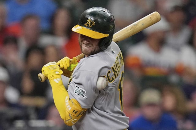 Athletics&#39; Max Schuemann is hit by a pitch thrown by Houston Astros starting pitcher Ryan Gusto during the second inning of a baseball game Friday, July 25, 2025, in Houston. (AP Photo/David J. Phillip)