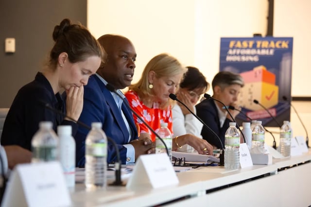 people at a table with microphones