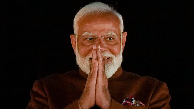 Prime Minister Narendra Modi gestures during celebrations at the BJP headquarters after the party won the Delhi assembly election, 