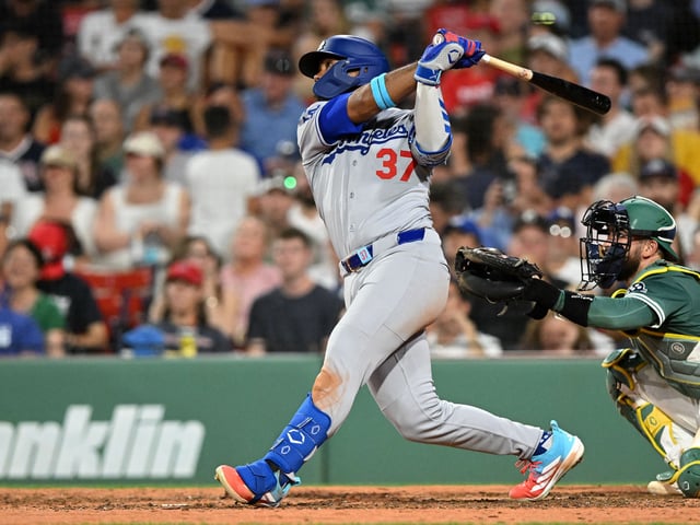 Jul 25, 2025; Boston, Massachusetts, USA;  Los Angeles Dodgers right fielder Teoscar Hernandez (37) hits a two-run home run against the Boston Red Sox during the eighth inning at Fenway Park. Mandatory Credit: Brian Fluharty-Imagn Images
