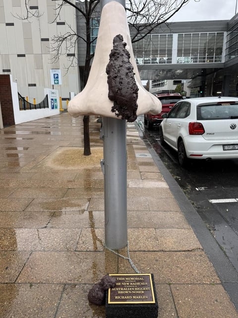 A piece of protest art was left in the Geelong CBD labelling Richard Marles "Australia's biggest brown-noser" on the day of the signing of the Geelong treaty. Picture X / @maximum_chips