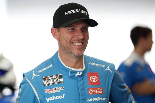 Denny Hamlin, driver of the #11 Progressive Toyota, waits in the garage area during practice for the NASCAR Cup Series Brickyard 400 Presented by PPG at Indianapolis Motor Speedway on July 25, 2025 in Indianapolis, Indiana.