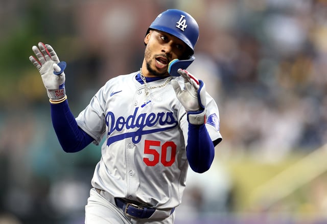 SAN DIEGO, CALIFORNIA - OCTOBER 08: Mookie Betts #50 of the Los Angeles Dodgers rounds the bases after hitting a home run in the first inning against the San Diego Padres during Game Three of the Division Series at Petco Park on October 08, 2024 in San Diego, California.
