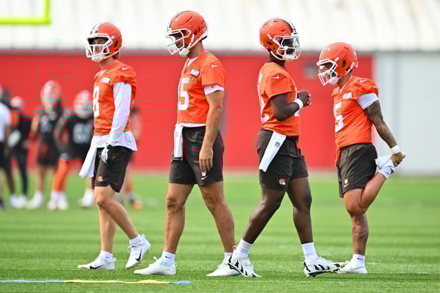 Quarterbacks Kenny Pickett #8 Joe Flacco #15 Shedeur Sanders #12 Dillon Gabriel #5 of the Cleveland Browns warm up before organized team activities at CrossCountry Mortgage Campus on June 12, 2025 in Berea, Ohio.