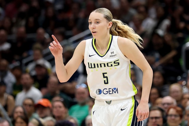 Paige Bueckers #5 of the Dallas Wings reacts after a basket against the Seattle Storm during the second half at Climate Pledge Arena on July 22, 2025 in Seattle, Washington.