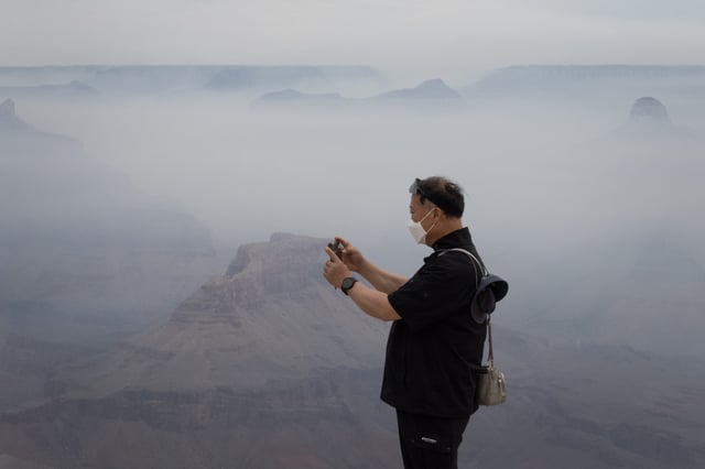 Stock photograph showing smoke from the Dragon Bravo fire filling the Grand Canyon along the South Rim near the Yavapai Geology Museum on July 17, 2025 in Grand Canyon, Arizona.