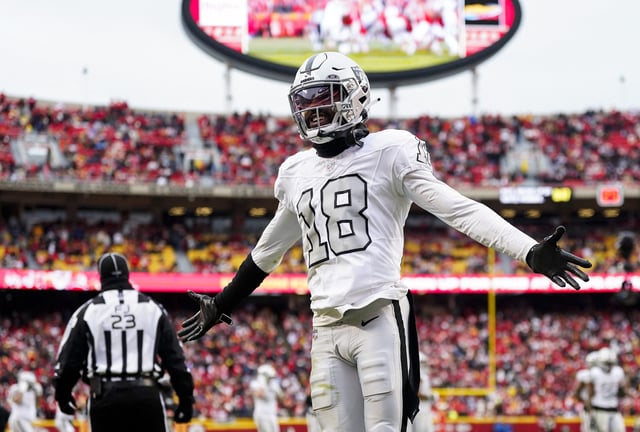 Dec 25, 2023; Kansas City, Missouri, USA; Las Vegas Raiders cornerback Jack Jones (18) interacts with then crowd during the second half against the Kansas City Chiefs at GEHA Field at Arrowhead Stadium. Mandatory Credit: Jay Biggerstaff-USA TODAY Sports/File Photo