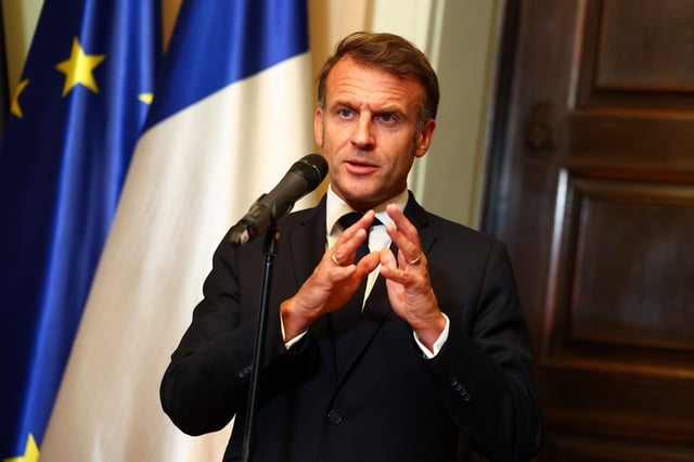 French President Emmanuel Macron talks to media prior to talks with German Chancellor Friedrich Merz at Villa Borsig on July 23, 2025 in Berlin, Germany.