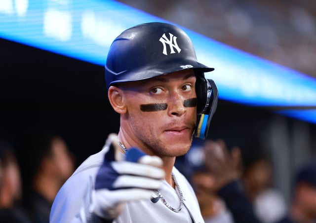 TORONTO, ON - JULY 23: Aaron Judge #99 of the New York Yankees reacts in the dugout after hitting a 2 run home run in the sixth inning during a game against the Toronto Blue Jays at Rogers Centre on July 23, 2025 in Toronto, Ontario, Canada.