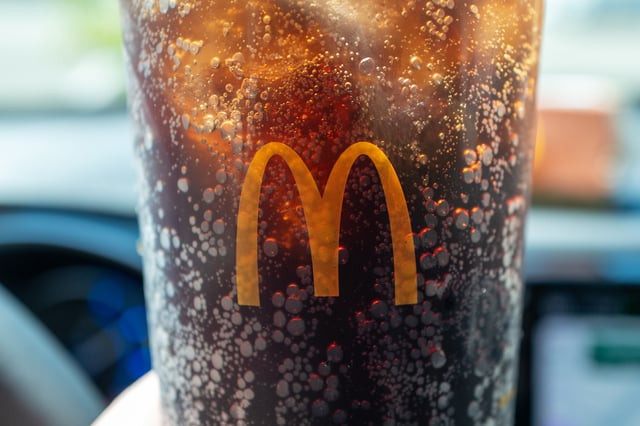 Person’s hand holding a McDonald’s Coca Cola drink in large cup with logo visible in a car in San Ramon, California, August 3, 2024. (Photo by Smith Collection/Gado/Getty Images)
