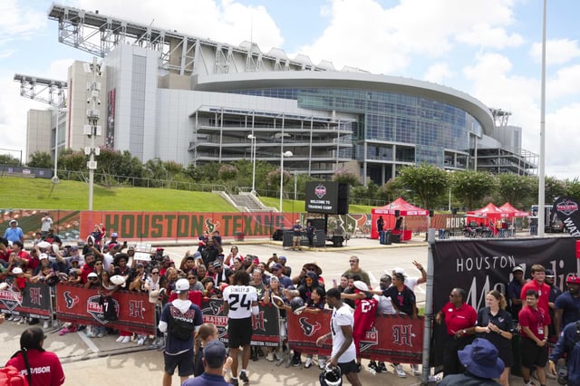Houston Texans cornerback Derek Stingley Jr. (24) signs autographs for fans after an NFL training camp practice at Houston Methodist Training Center in Houston, Saturday, July 26, 2025.
