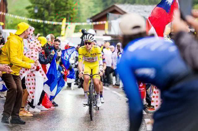 Tadej Pogacar rides past enthusiastic crowds during stage 19 of the 2025 Tour de France, from Albertville to La Plagne on July 25, 2025.
